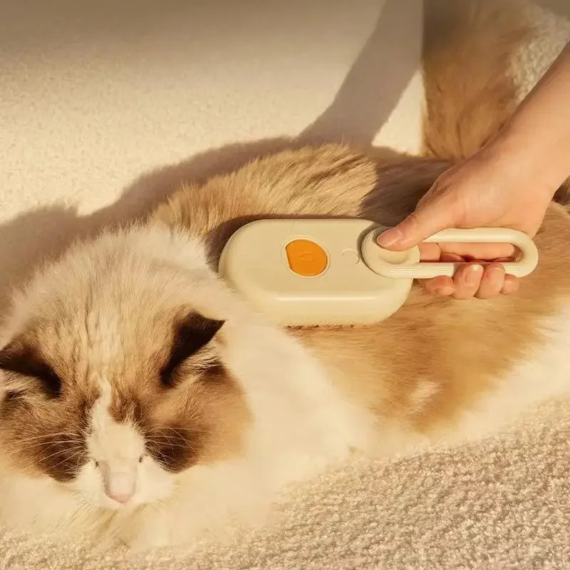 3-in-1 pet steam brush being used on a cat for cleaning and massage